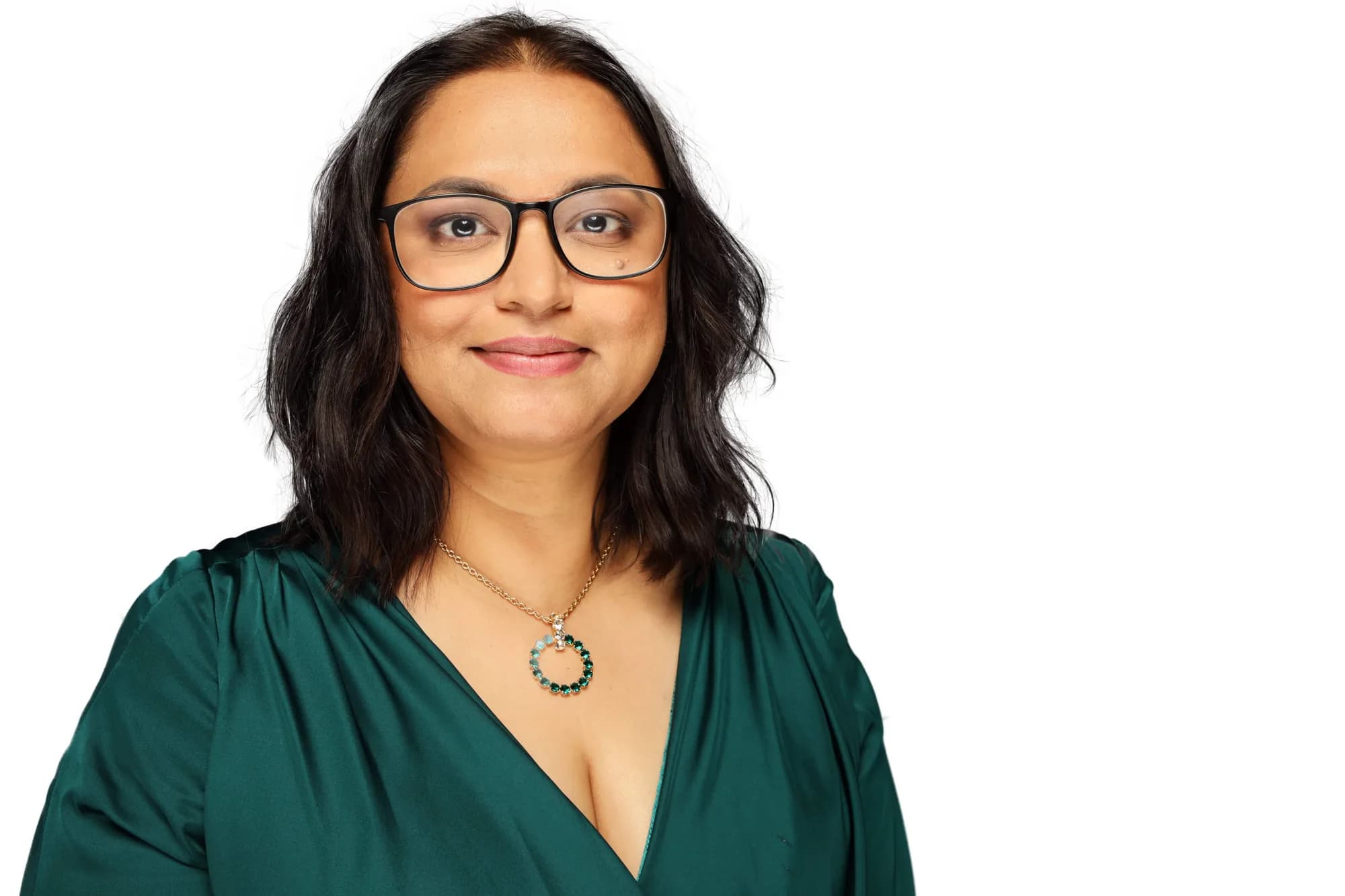 Corporate headshot of a woman in green on a white background, Sydney