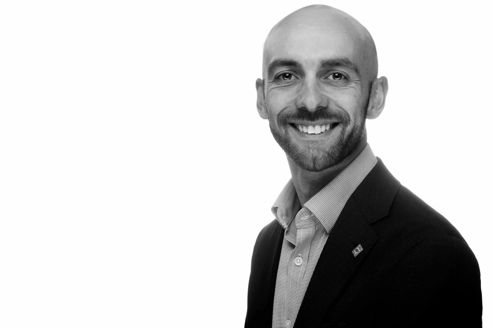 Black-and-white corporate headshot of a man, Sydney studio